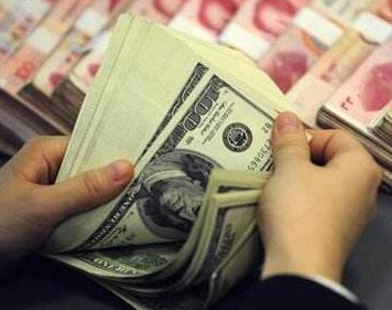 人民币对美元汇率中间价报6.7307元 下调102个基点