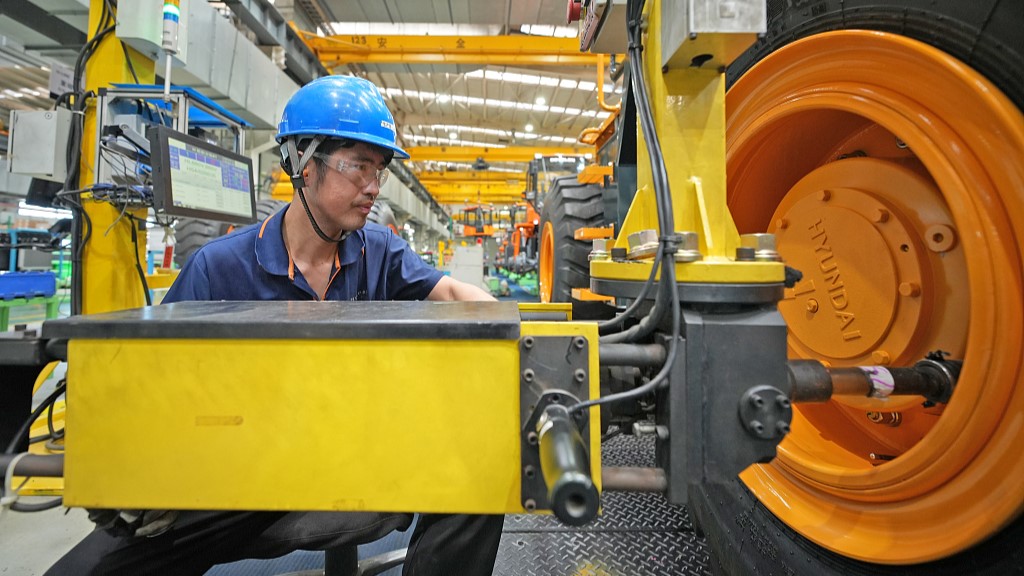 A staff operating on a production line at the mechanic company in east China's Shandong Province, July 17, 2023. /CFP