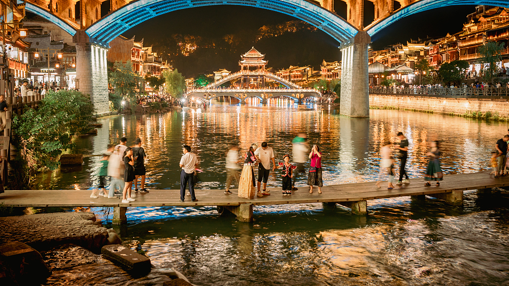 This photo taken on July 17, 2023 shows a night view of the ancient town of Fenghuang，Hunan Province, China. /CFP