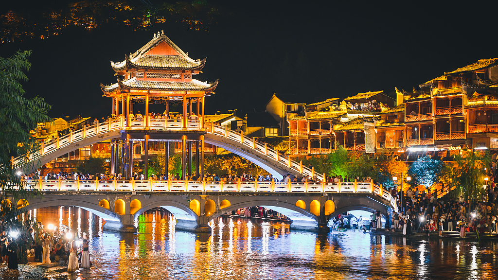 This photo taken on July 17, 2023 shows a night view of the ancient town of Fenghuang，Hunan Province, China. /CFP