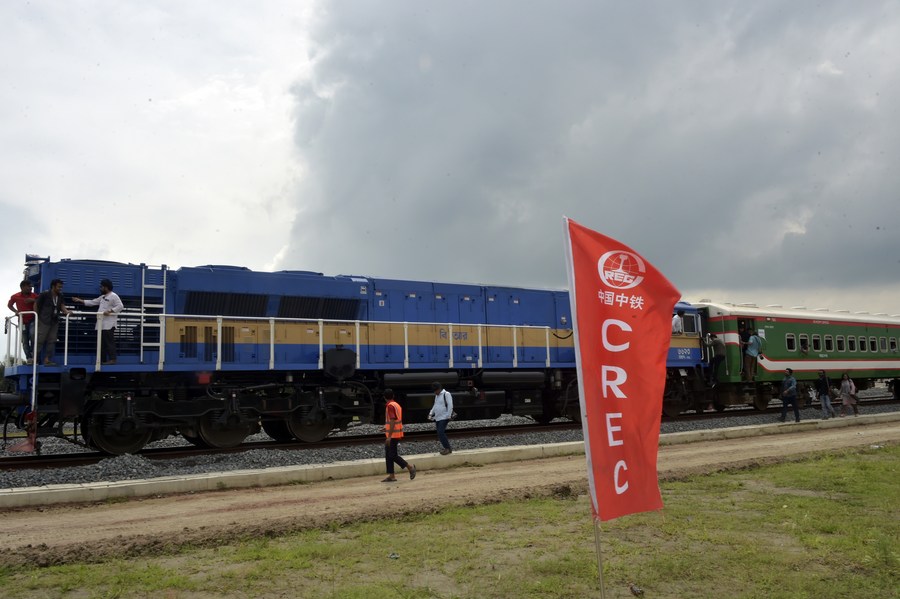 Passengers prepare to board a train during a trial run along the newly constructed mega Belt and Road Initiative (BRI) rail line that crosses the China-built Padma Bridge on the outskirts of Dhaka, Bangladesh, September 7, 2023. /Xinhua