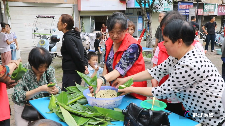 粽香童趣庆双节！心街坊社区包粽子比赛欢乐开赛.mp4_20250603_162622.323.jpg