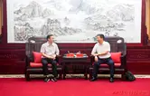 许忠建会见程伟一行